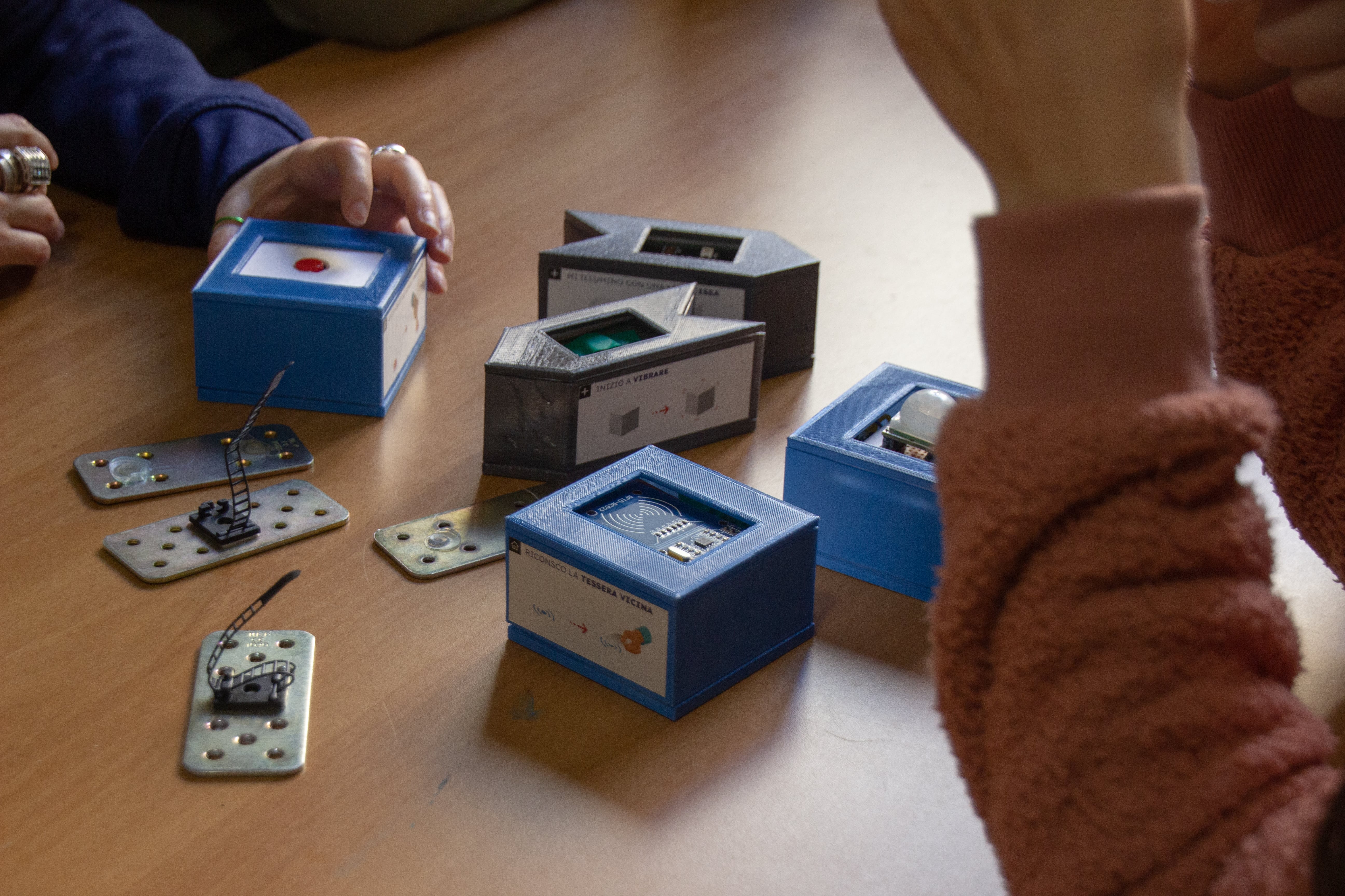 Workshop participants exploring MakeNodes on a table